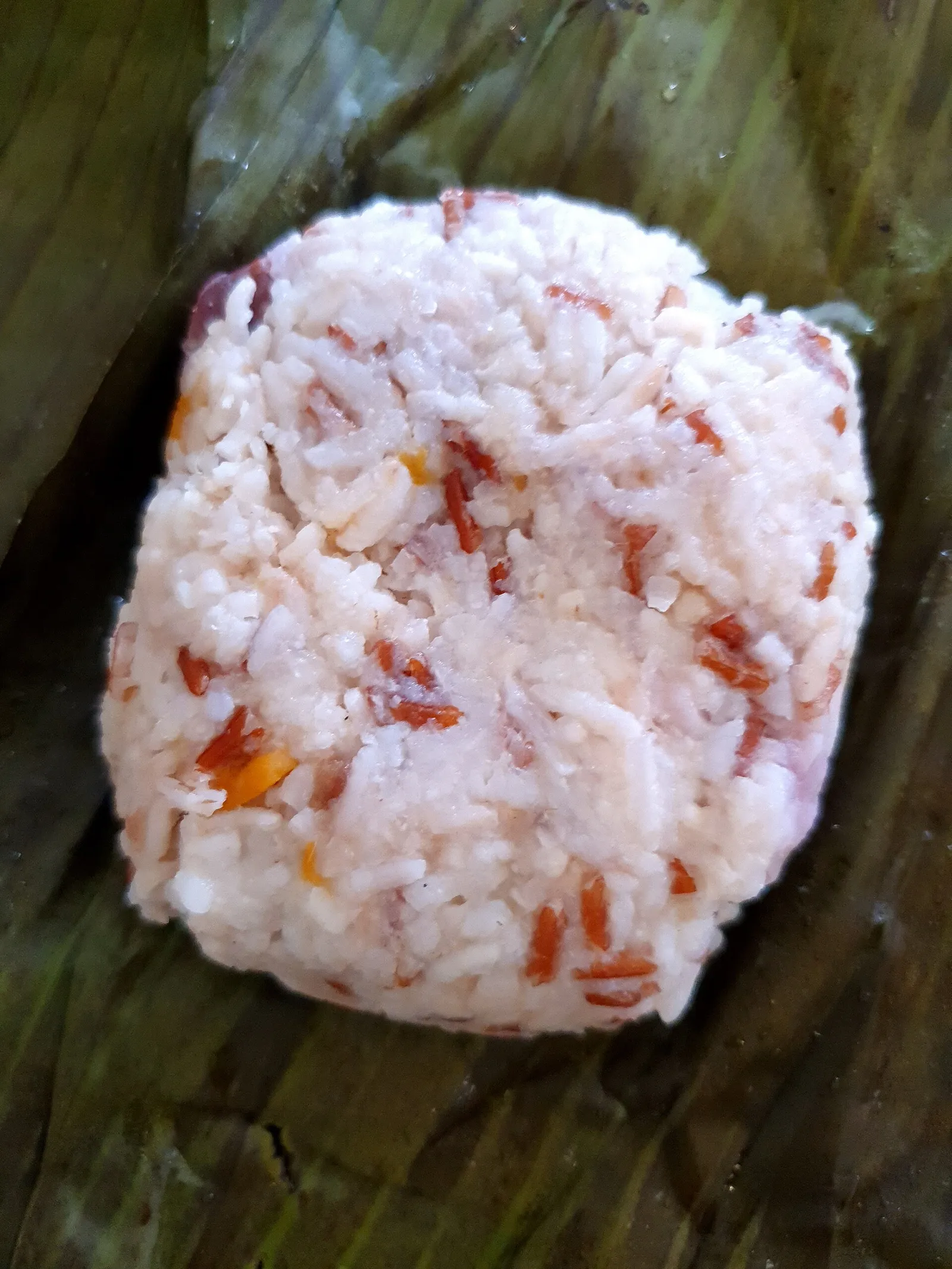 Linopot or linopod (steamed rice and yam in banana leaf) is a traditional Dusun food from Sabah
