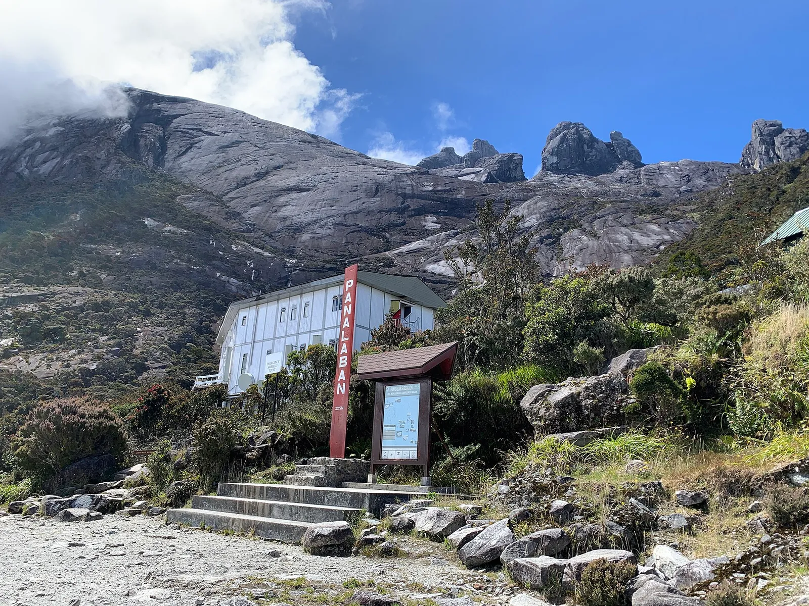 Panalaban sign and Laban Rata Resthouse below the granite summit peaks